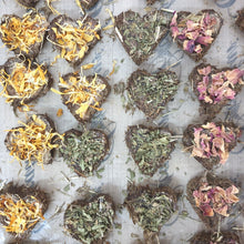 Load image into Gallery viewer, a tray of freshly made herb hearts treats in four colours - made for hamsters guineapigs and hamsters in singapore
